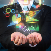businessman holds up data visualization examples