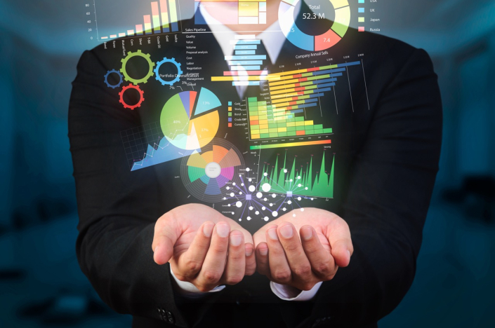 businessman holds up data visualization examples