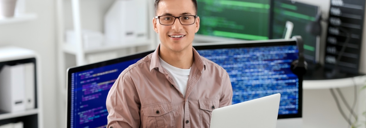 IT programmer working on his laptop