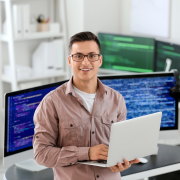IT programmer working on his laptop