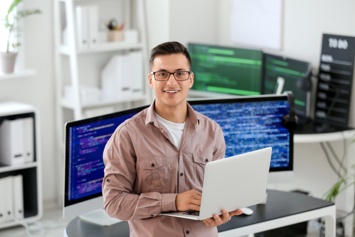 IT programmer working on his laptop