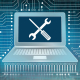 An image of a computer against a cyber background, with a screwdriver and wrench crossed over the screen.