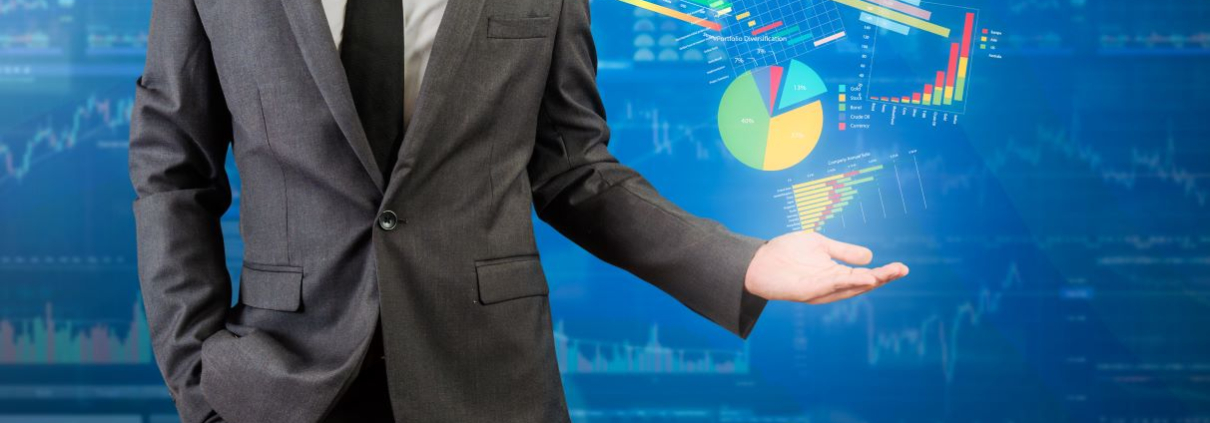 A man in a suit hold out his hand, where projections of various data visualizations hover over his hand.